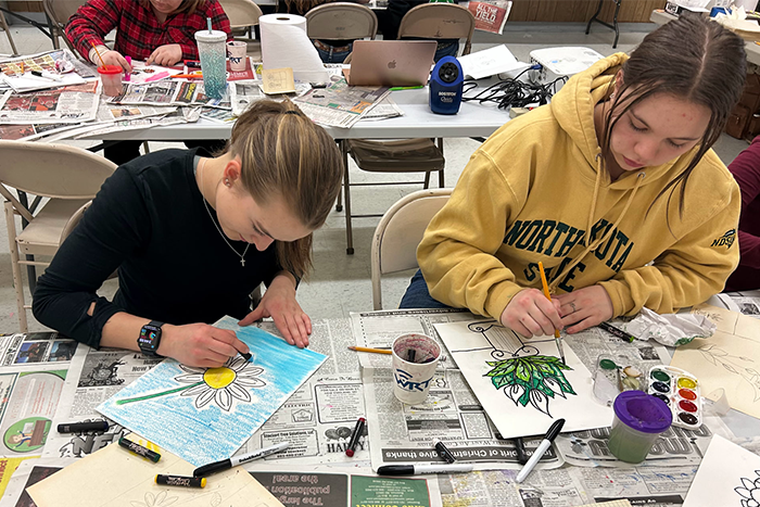 New Leipzig students painting with watercolors during an Artist in Residency with Nicole Gagner