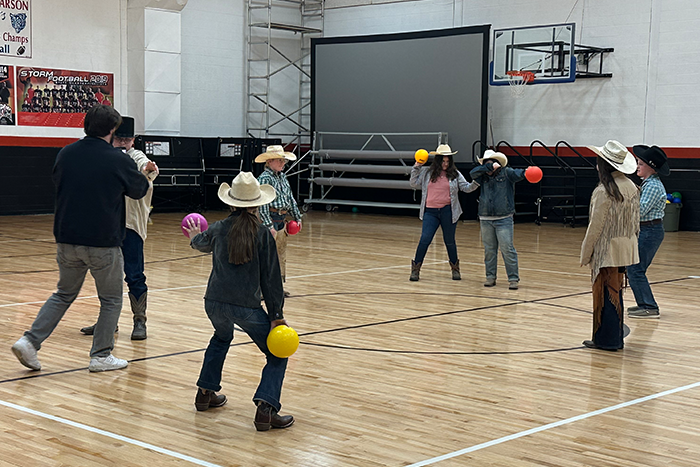 Students from Roosevelt School in Carson, ND, dressed up as cowboys and cowgirls, playing dodgeball in a school gym