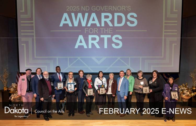 2025 ND Governor's Awards for the Arts text on a big screen behind the Governor, First Lady and all 7 recipients on a big stage